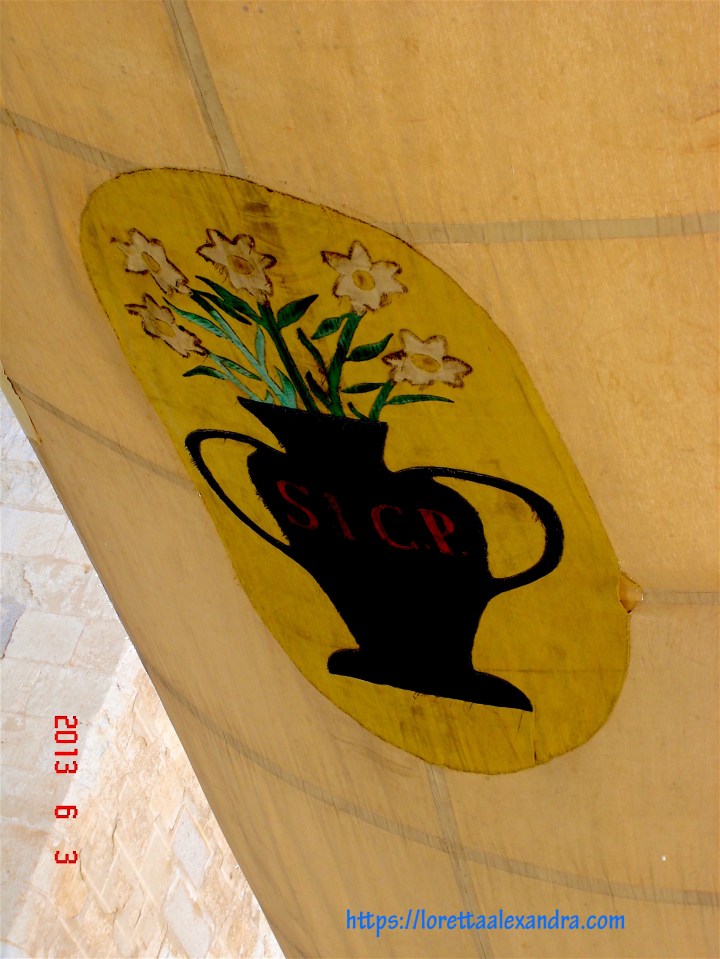 Canvas awnings are strung overhead to protect the religious procession celebrating Corpus Christi