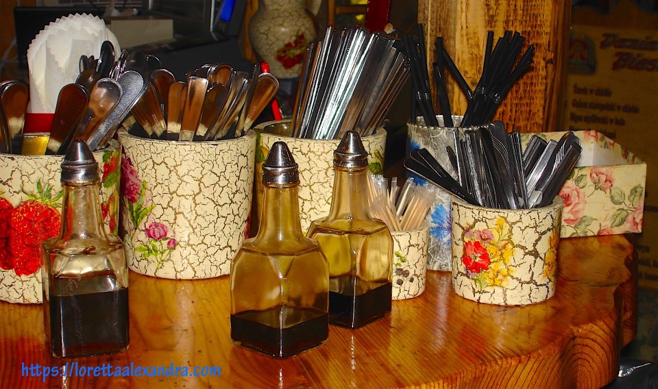 At U Babci Maliny, it’s sitting at community tables on wood benches, and grabbing your own eating utensils from the bar.