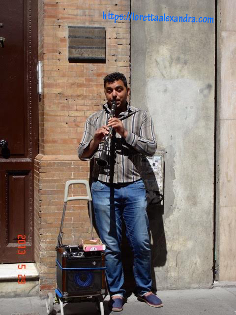 Clarinet playing street musician, Seville, Spain.