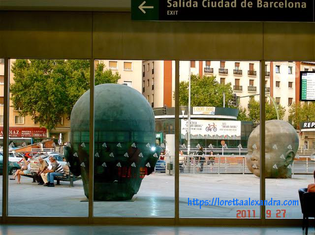 Sculptor Antonio Lopez Garcia's baby heads, Day and Night “ - at the Atoche Railway Station entrance, Madrid, Spain.