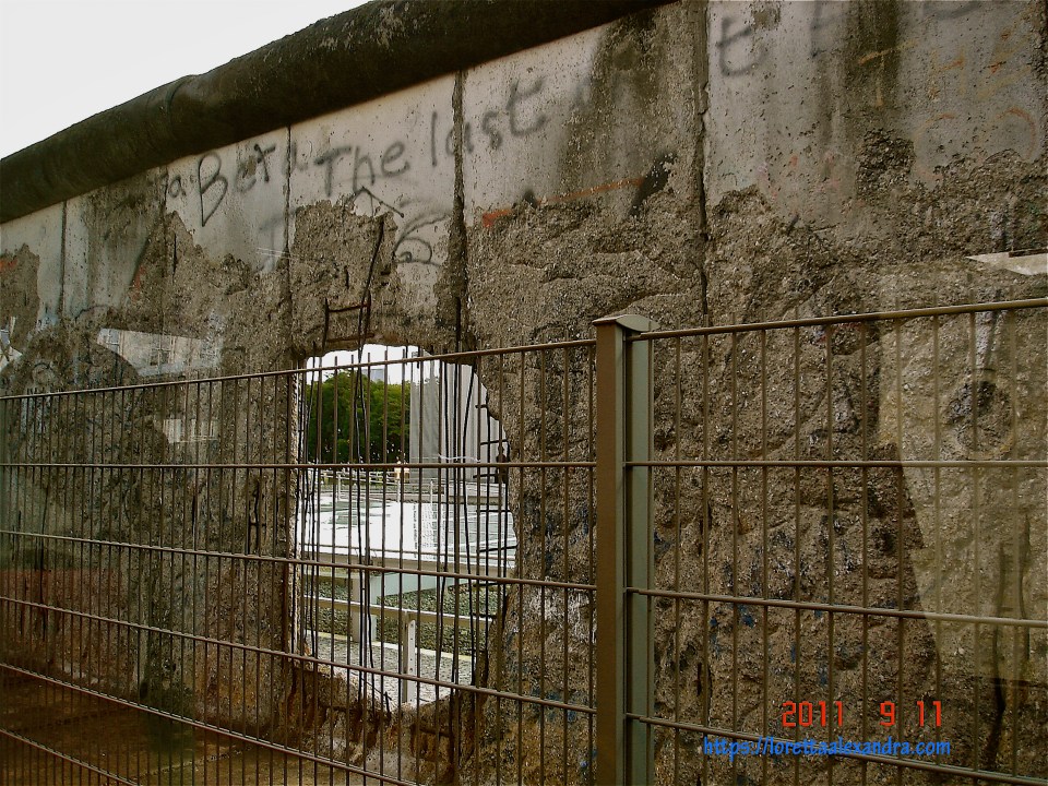 Seeing the former Western Sector through a hole in the Berlin Wall Memorial.